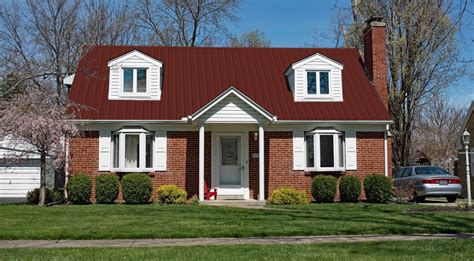 burgundy metal roof and red brick houses|red metal roofing.